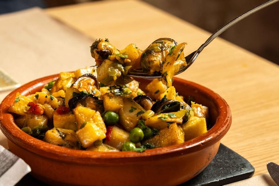 Alcudia: Self-Guided Gourmet Tapas and Wine Tour - Walking through the Old Town between bites