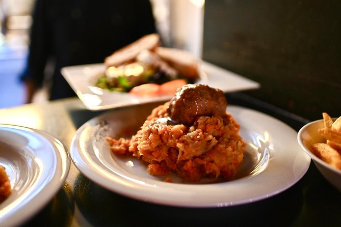 Amsterdam Food Tour of 10+ Local Classic Tastings in Jordaan Area - The fishmonger stop: herring and kibbeling