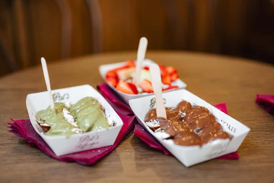 Amsterdam: Guided Cultural Food Tour in English or German - Magna Plaza and the canal belt: a change of scale