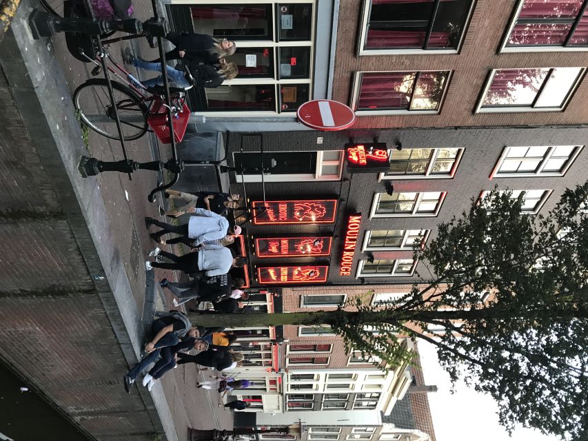 Amsterdam: Private Red Light District and Food Tour - Canals, Flower Market, and the changing city