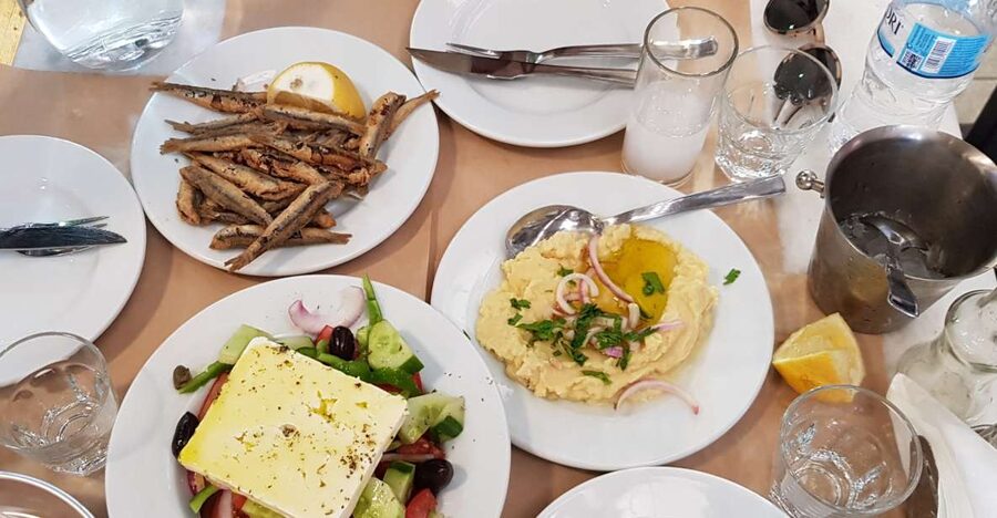 Athens: Traditional Greek food tour in hidden spots - Starting among Athens market stalls