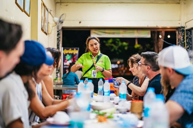 Bangkok: Midnight Food Tour by Tuk-Tuk - A rooftop drink with Wat Arun in the distance