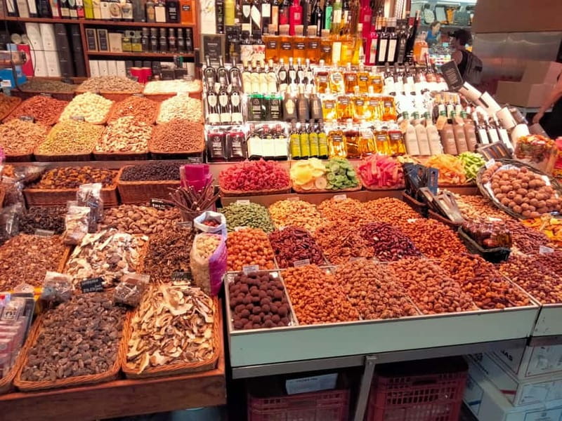 Barcelona: Markets Tour With Food and Wine Tasting Upgrade - The caganer shop and Catalan humor