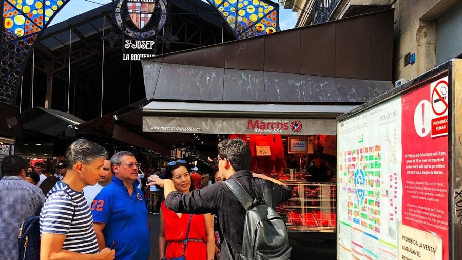 Barcelona: Street Food & Sightseeing Tour with Local Market - Walking Through La Boqueria Market