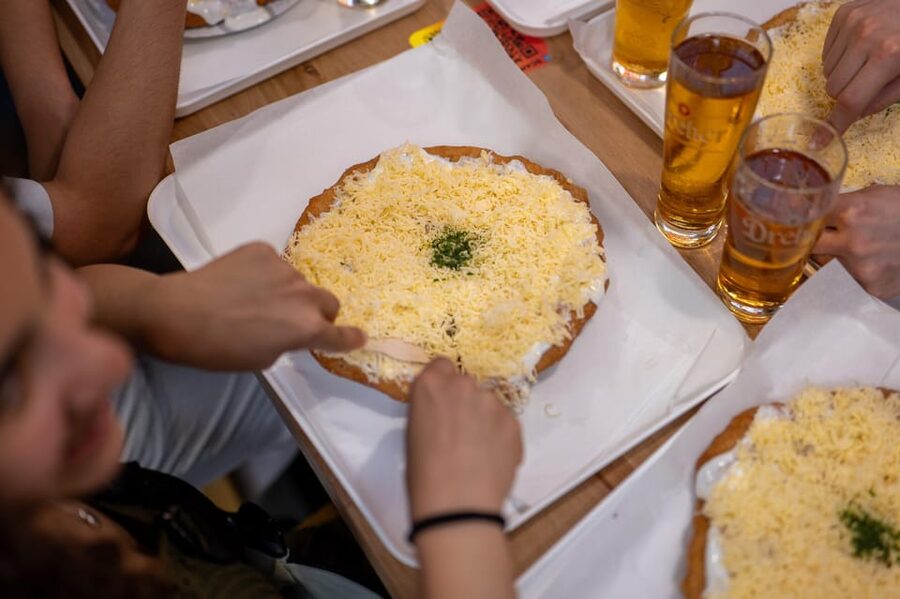 Budapest: Guided Food Tour with Wine, Beer, and Shots - Walking through District 7 and toward Andrassy Avenue