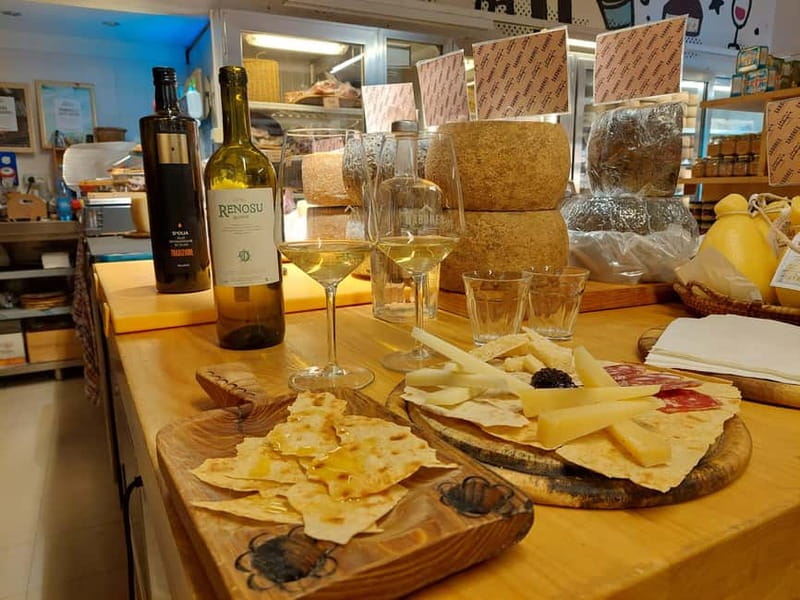 Cagliari: Taste Sardinia with a Full Meal Food Tour - Pecorino, local ham, and a glass of Sardinian wine