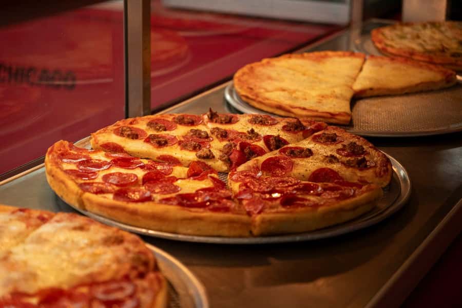 Chicago: The Ultimate Foodie Walking Tour with Tasty Stops - Starting beneath the Chicago Theatre marquee