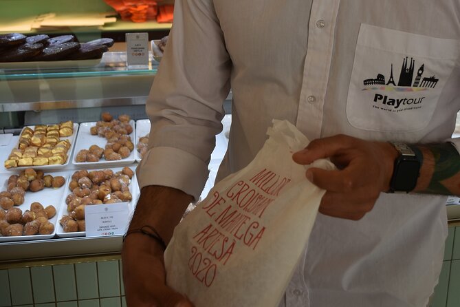Cultural Walking Tour in Barcelona with Food & Wine Tasting - La Boqueria: market history with ham and paella
