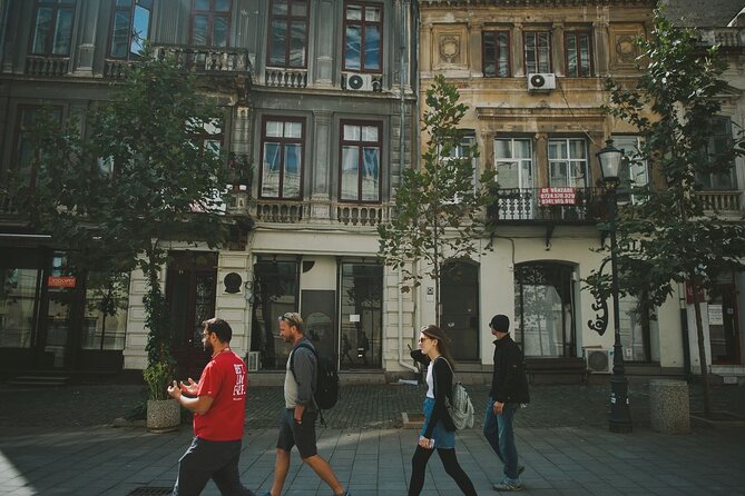 Discover Bucharest: Private Highlights and Traditional Food Tour - The Romanian meal: mici, sarmale, soup, and papanasi
