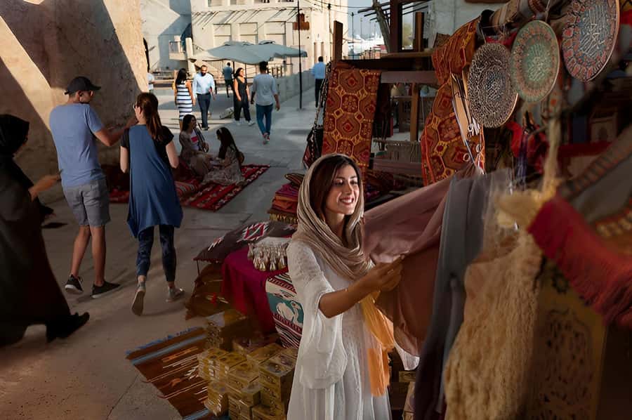 Dubai: Old Town Walking Tour with Abra Cruise & Street Food - Textile Souk, color, trade, and careful shopping