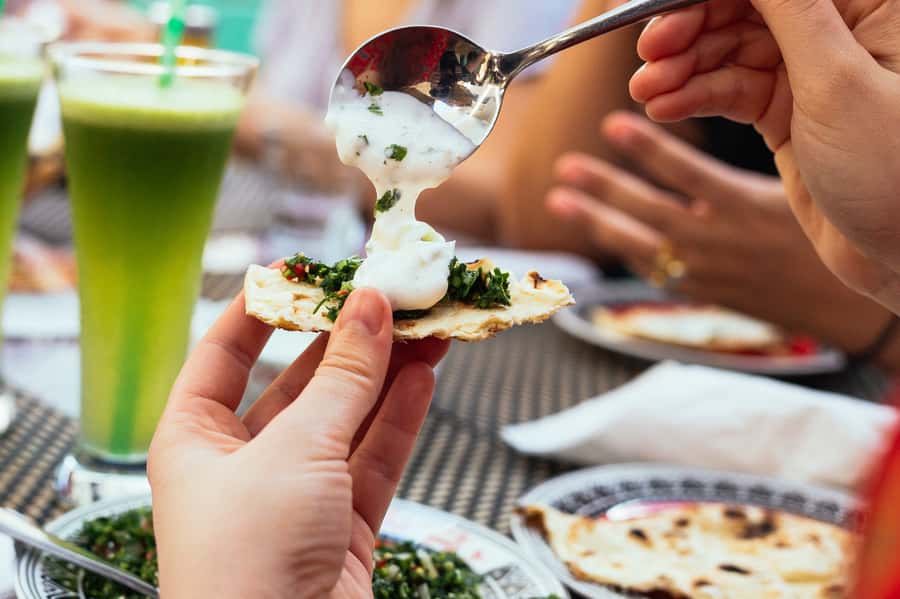 Dubai: Private Food Tour – 10 Tastings with Locals - Tasting dates and falafel in local settings