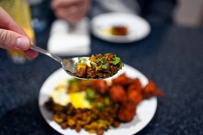 East London Indian Food Tour with 8+ Authentic Food Tastings - The first tastings: pakoras, curry, and mango lassi