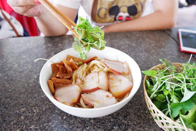 Evening Walking Food Tour, folk game and lantern boat - Walking Hoi An’s lanes with a guide