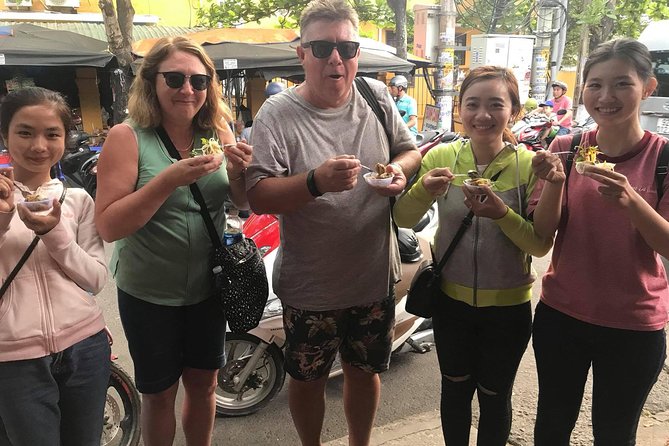 Evening Walking Food Tour, folk game and lantern boat - A short boat ride and floating lantern on the river
