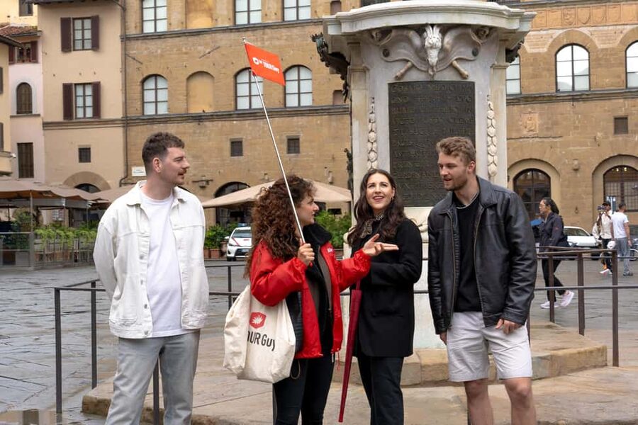 Florence: Food Walking Tour with Local Steak and Tuscan Wine - Crossing Ponte Vecchio toward Oltrarno