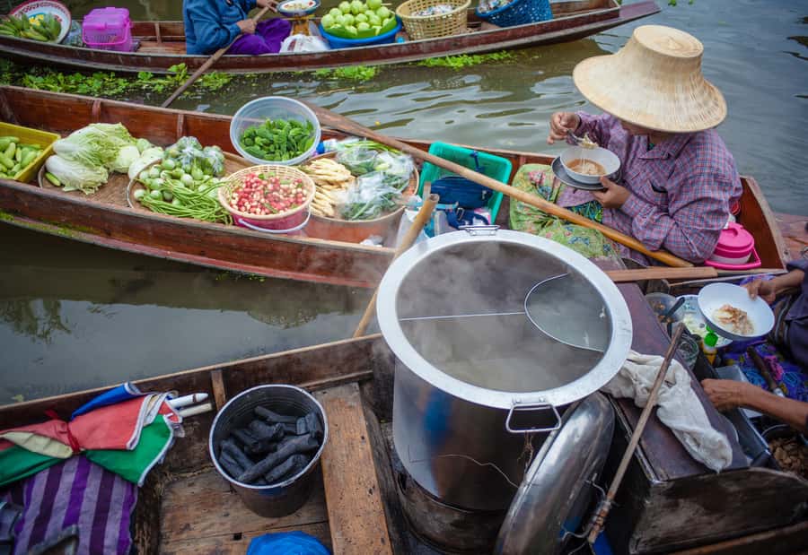 From Bangkok: Maeklong Railway and Floating Market Food Tour - Tasting Thai snacks beside the tracks