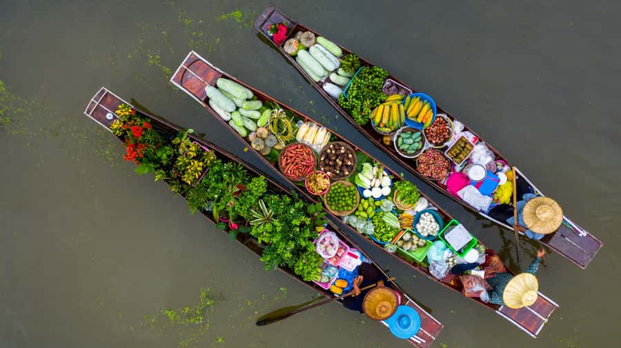 From Bangkok: Maeklong Railway and Floating Market Food Tour - Watching Mae Klong Market make room for a train