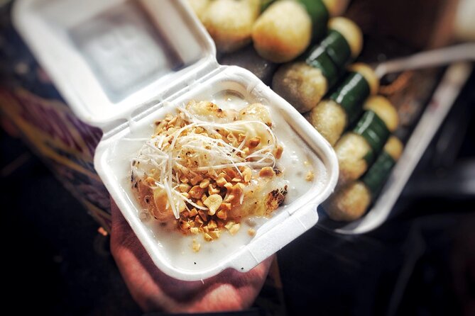 Ho Chi Minh City Street Food Tour & Sightseeing By Motorbike - Bánh khọt among the Nguyễn Thiện Thuật apartments