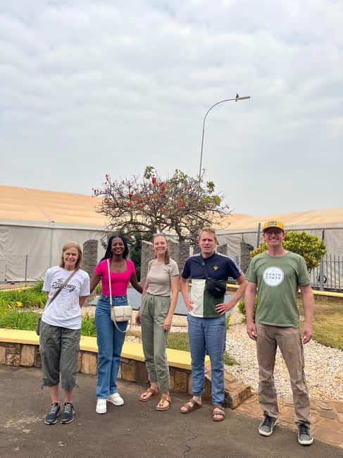 Kigali: Guided Art, History, and Food Tour with Moto Ride - Walking to the Kigali city-center sign