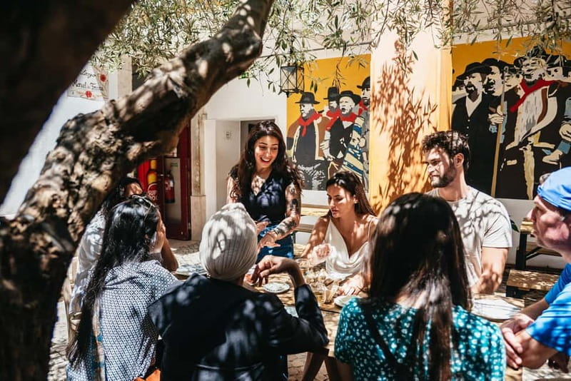 Lisbon: Baixa District Food Tour with Dinner and Drinks - Starting beneath the Portuguese flag