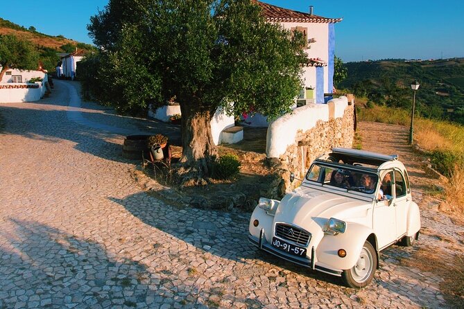 Lisbon Countryside Food Tour on a Vintage Car - Mafra’s palace gives the day some scale