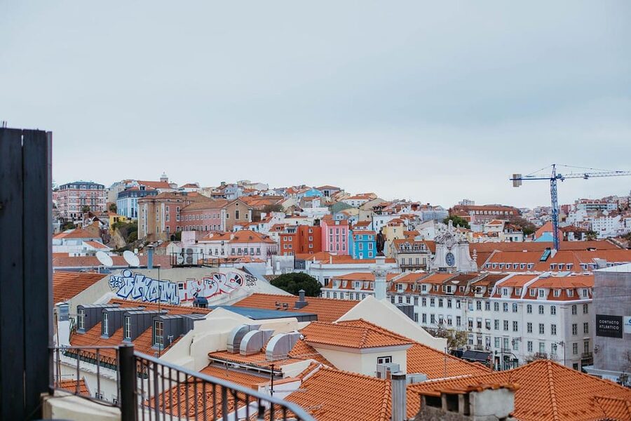 Lisbon: Evening Food & Wine Tour in Bairro Alto - Entering Bairro Alto through old cobbled streets