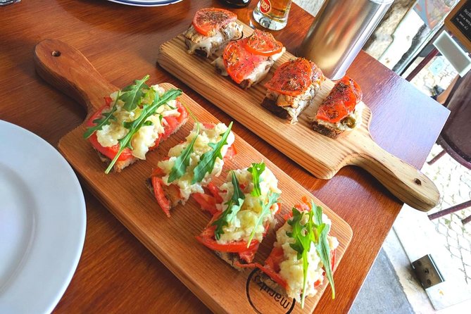 Lisbon Small-Group Food Tour with 18 Tastings in Alfama District - Alfama through food, history, and small local stops