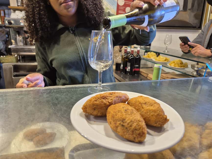 Lisbon Small-Group Food & Wine Tour Eat & Drink like a Local - Chouriço Assado with red wine