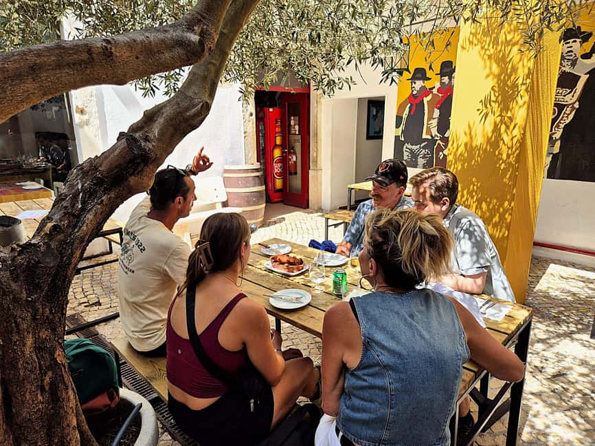 Lisbon Small-Group Food & Wine Tour Eat & Drink like a Local - Guide quality and the human side of the tour
