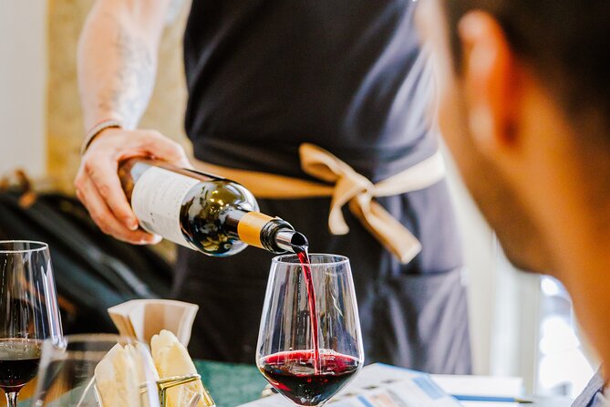 Lisbon Small-Group Portuguese Food and Wine Tour - Port, cheese, chouriço, and Portuguese small plates
