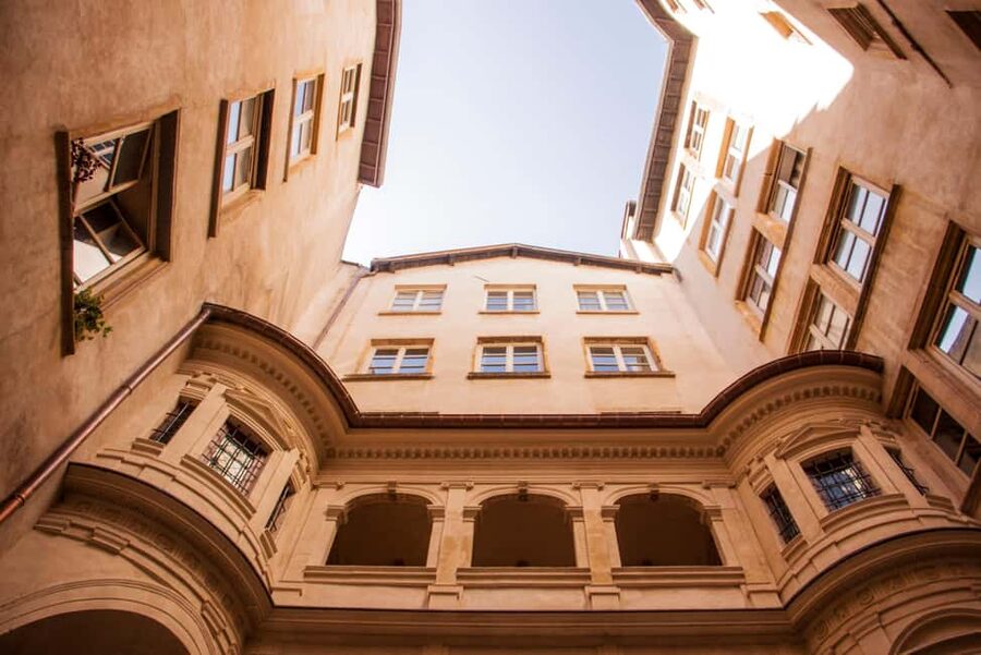 Lyon: Old Town Food Tour with 6 French Food Tastings & Wine - Crossing the Saône to the Presqu’île