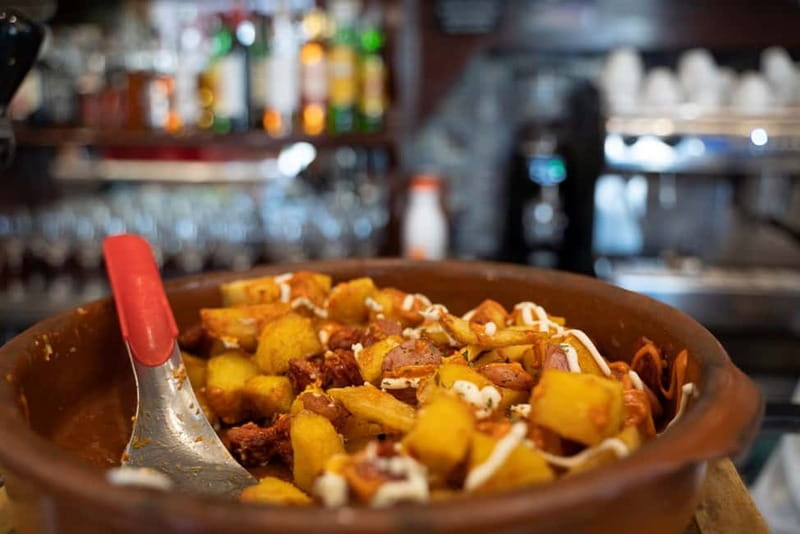 Madrid: Evening Tapas Tour with 5 Delicious Stops & Drinks - Plaza Mayor and the Squid Sandwich