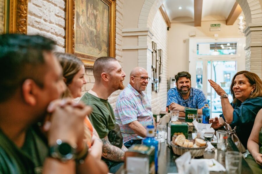 Madrid: Food & Wine Tour with 10 Tapas & 4 Drinks Included - The first stop: market cooking and a gentle start