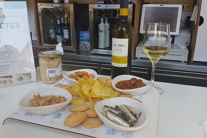 Madrid Small Group Tapas Tour at 4 Venues -Lunch or Dinner - Iberian ham takes center stage at the third venue