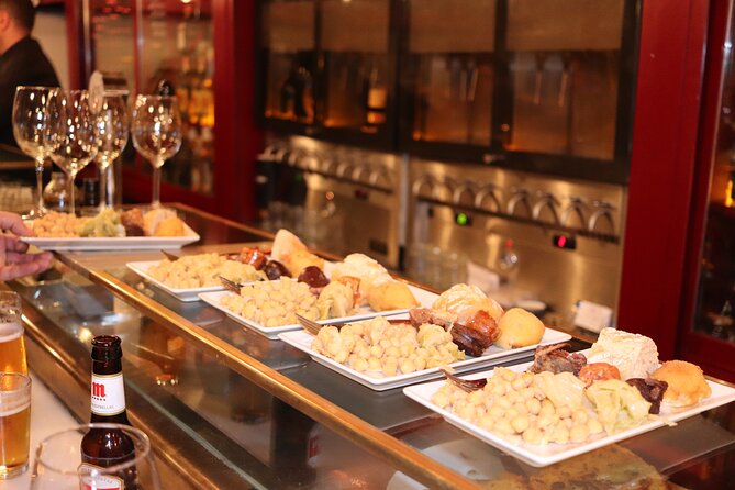 Madrid Small Group Tapas Tour at 4 Venues -Lunch or Dinner - Churros and dark chocolate finish the walk