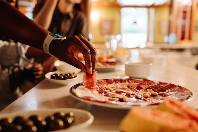 Madrid Tapas & Taverns Small Group Food & History Tour - Mesón del Champiñón serves classic bar food