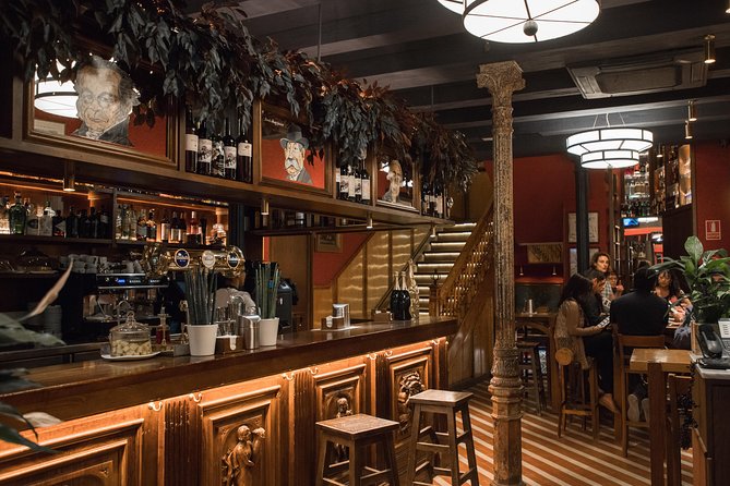 Madrid Tapas & Wine Tasting Walking Tour – Small Group Local Bars - Walking through Calle de las Huertas