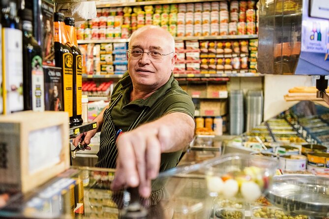 Madrid Ultimate Spanish Cuisine Food Tour - Casa González: cheese, wine, and a surprising past