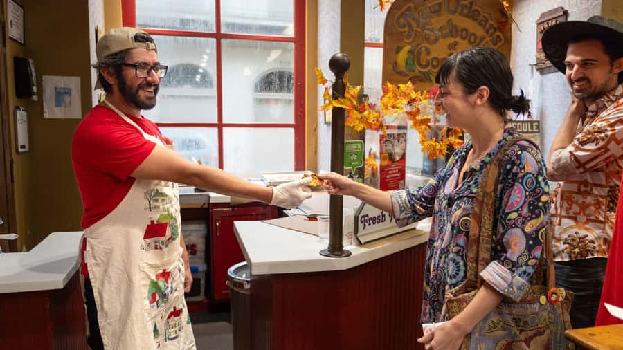 New Orleans: Beloved Bites & Famous Dishes Food Tour - The first beignet sets the tone