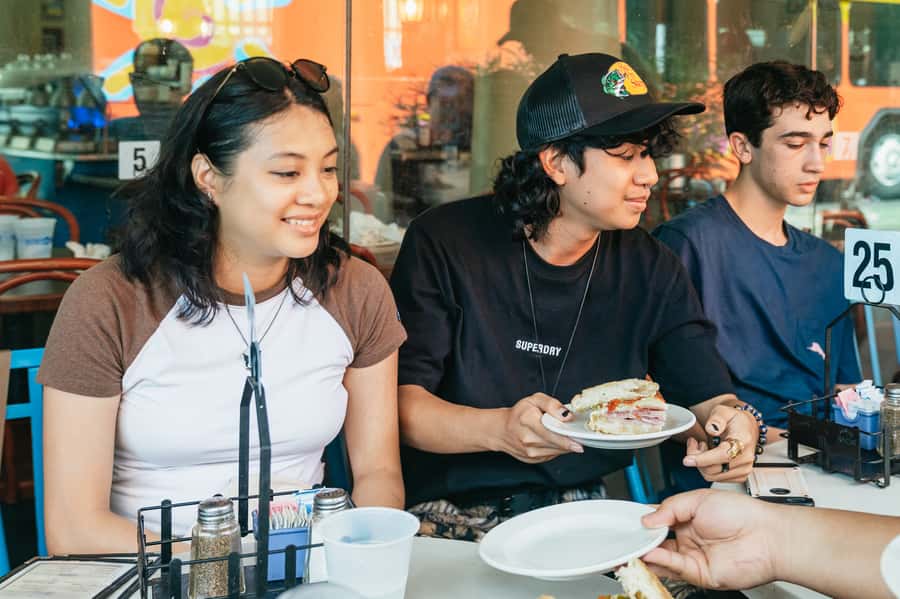 New Orleans: Beloved Bites & Famous Dishes Food Tour - Exploring the French Market between bites