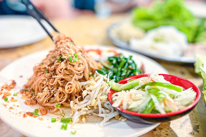 Old Siem Reap Sunset Food Tour by Tuk-tuk - Stop three: Phnom Krom, lotus fields, and a family meal