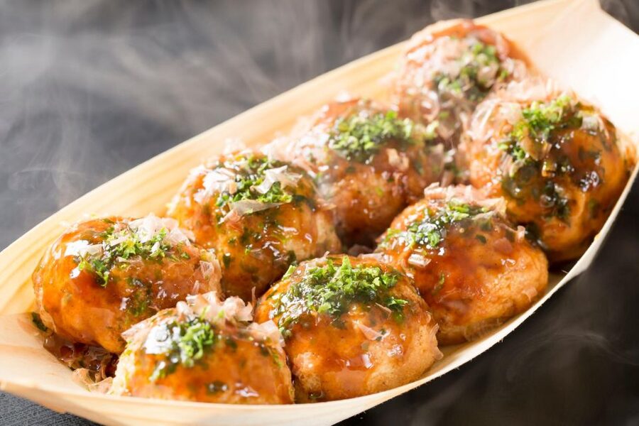 Osaka: Local Foodie Tour in Dotonbori and Shinsekai - Okonomiyaki becomes part of the entertainment