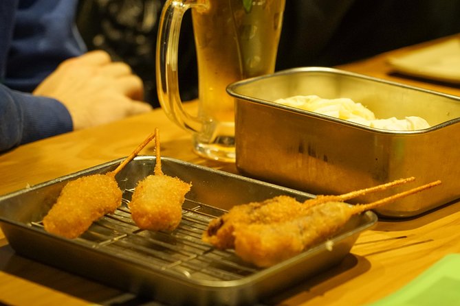 Osaka Local Foodie Walking Tour in Dotonbori and Shinsekai - From shopping streets to Dotonbori