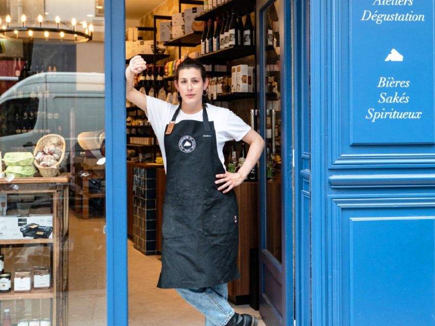 Paris: Gourmet Food Tour with Over 10 Tastings and Wine - A market street and a royal pastry connection