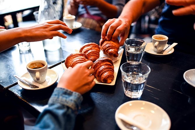 Paris Le Marais Food Tour With 10+ Tastings, Cheese, Wine & More - Learning to eat a baguette at the bakery