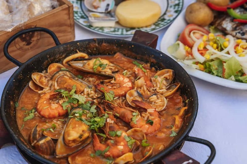 Private Lisbon Food Tour in Baixa with Wine & Local Delights - Starting beneath the Portuguese flag