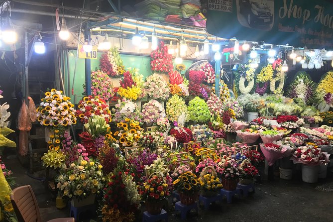 Private Saigon Night Food Tour by Scooter - Stop three: Ho Thi Ky Flower Market and Vietnamese pizza