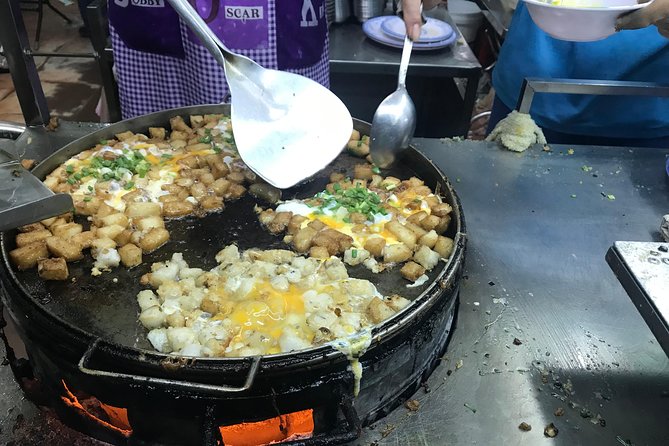 Private Saigon Night Food Tour by Scooter - Stop one: rice cakes, dumplings, and a local alley eatery