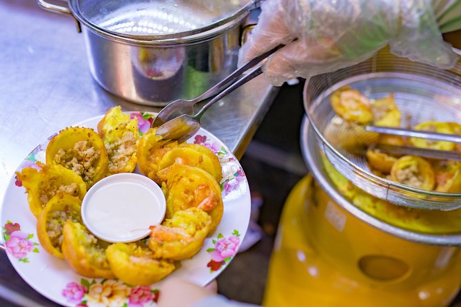 Private Street Food Evening Walking Tour in Ho Chi Minh City - Trying bo la lot and regional noodle soup