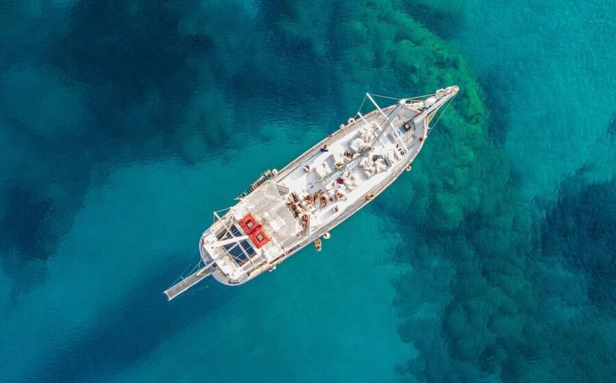 Rhodes: Boat Tour with Snorkeling, Gourmet Buffet & Open Bar - Afandou and the Traganou Caves set up lunch